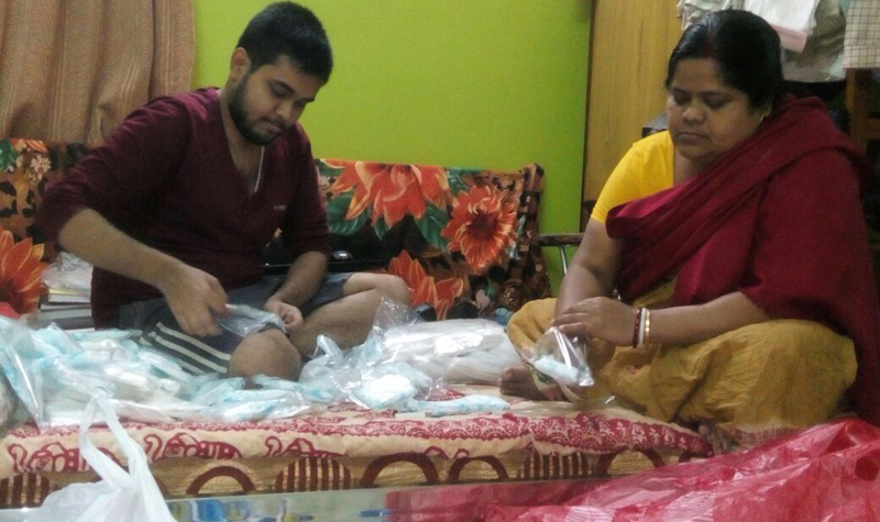 Kolkata Padman Sobhan Mukherjee packing sanitary napkins for Bandhan boxes